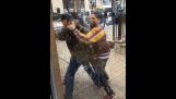 Security officer takes out his weapon on two attackers