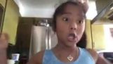 A girl introduces her little sister on camera