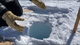 The sound of ice in a deep hole