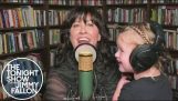 Alanis Morissette sings with her daughter in her arms