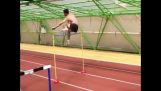 Olympic champion Stefan Holm jumps over hurdles