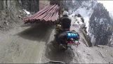 Trying to overtake on a scary mountain road by motorbike