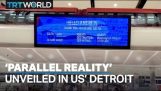 A futuristic screen at Detroit Airport, that displays different pixels depending on the position of people