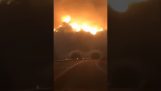 Dramatic video of a woman leading through the flames in California