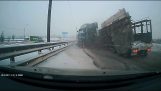 A truck crashes into cars on a slippery road