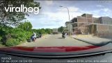 The swinging door of a truck nearly hits 2 people on scooters