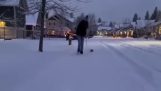 A small dog in deep snow