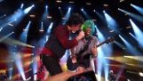 Girl from audience plays on stage with Green Day