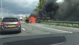 Burning car explodes on highway