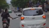 Man on scooter broken car mirrors