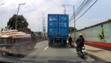 Truck passes over the rider's head, saved by the helmet