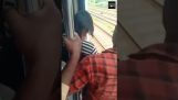 An 18 year old girl is saved the last second before falling off a train