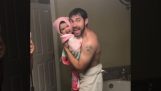 Father and daughter singing in the bathroom