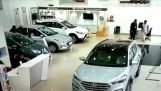 Woman starts a car inside Hyundai's showroom in India
