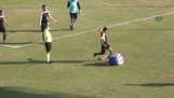 Unstrung footballer, kicking his opponent in the face