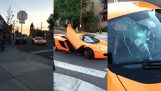 Kid breaks the windshield of a McLaren