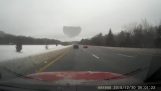 Piece of ice destroys the windshield on the freeway