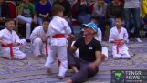 The Jean-Claude Van Damme in karate demonstration with young children