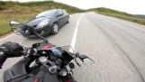 Motorcyclist closely avoids a collision with a car