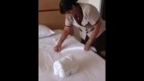 The maid prepares towels