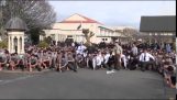 High school students perform a tribute to their teacher dancing Haka