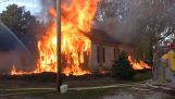 Firefighters start a controlled fire to a house infected with cockroaches