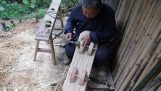 Grandfather builds a wooden scooter for his grandson