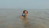 Tough Pakistani reporter doing story submerged in the flood