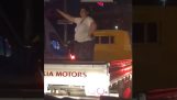 A woman dancing on the back of a van (Fail)