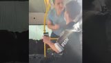 Mask refuser against young man on the bus