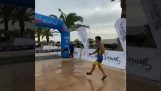A triathlete is celebrating before the finish line