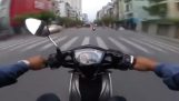 Police on scooters chase thieves (Vietnam)